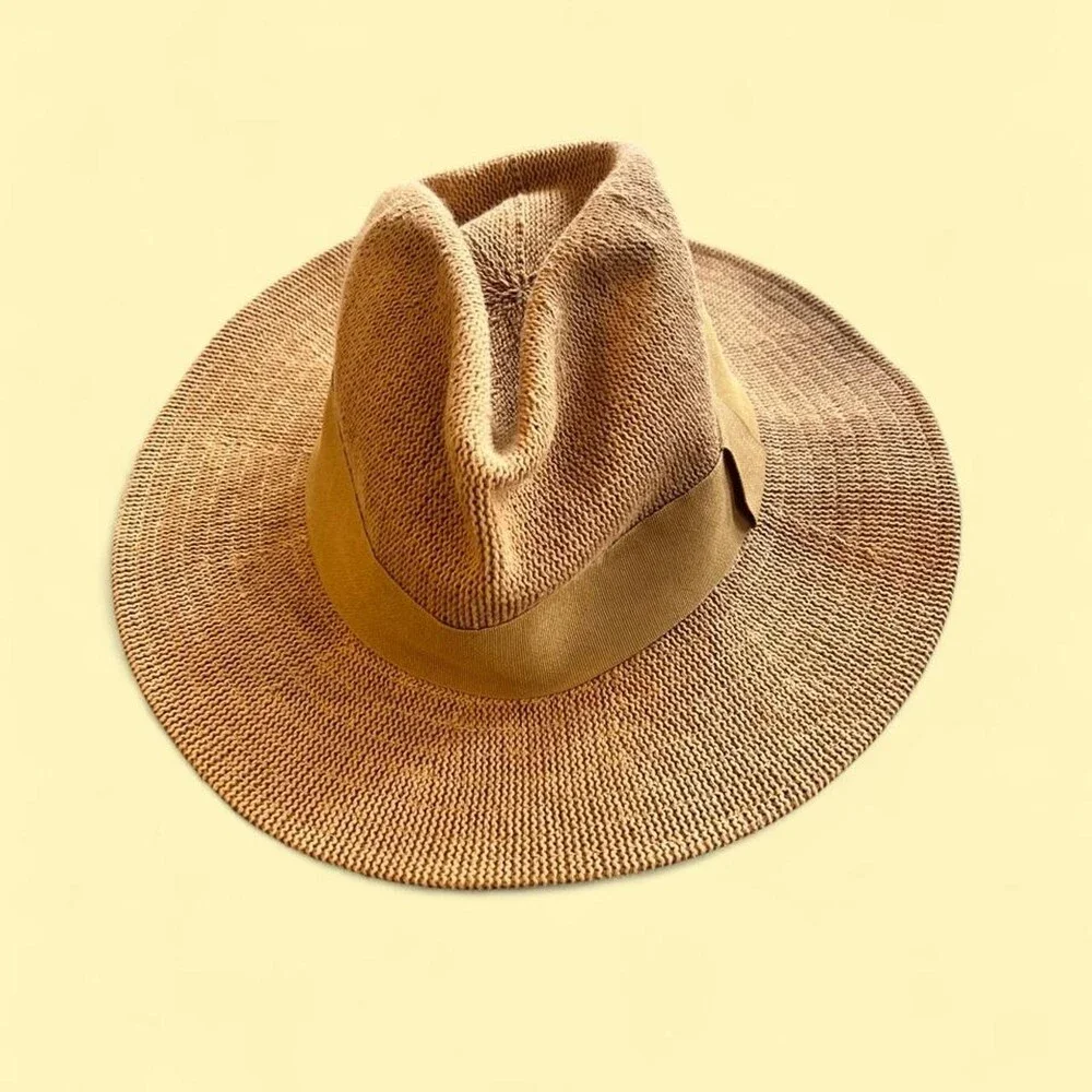 Tan straw fedora with a wide brim and a suede band. #western #boho